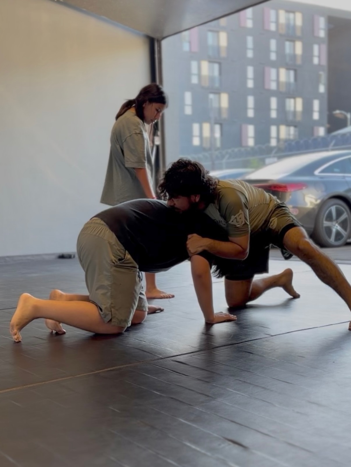 Cross-discipline training at MMA District — wrestling, BJJ, and striking under one roof