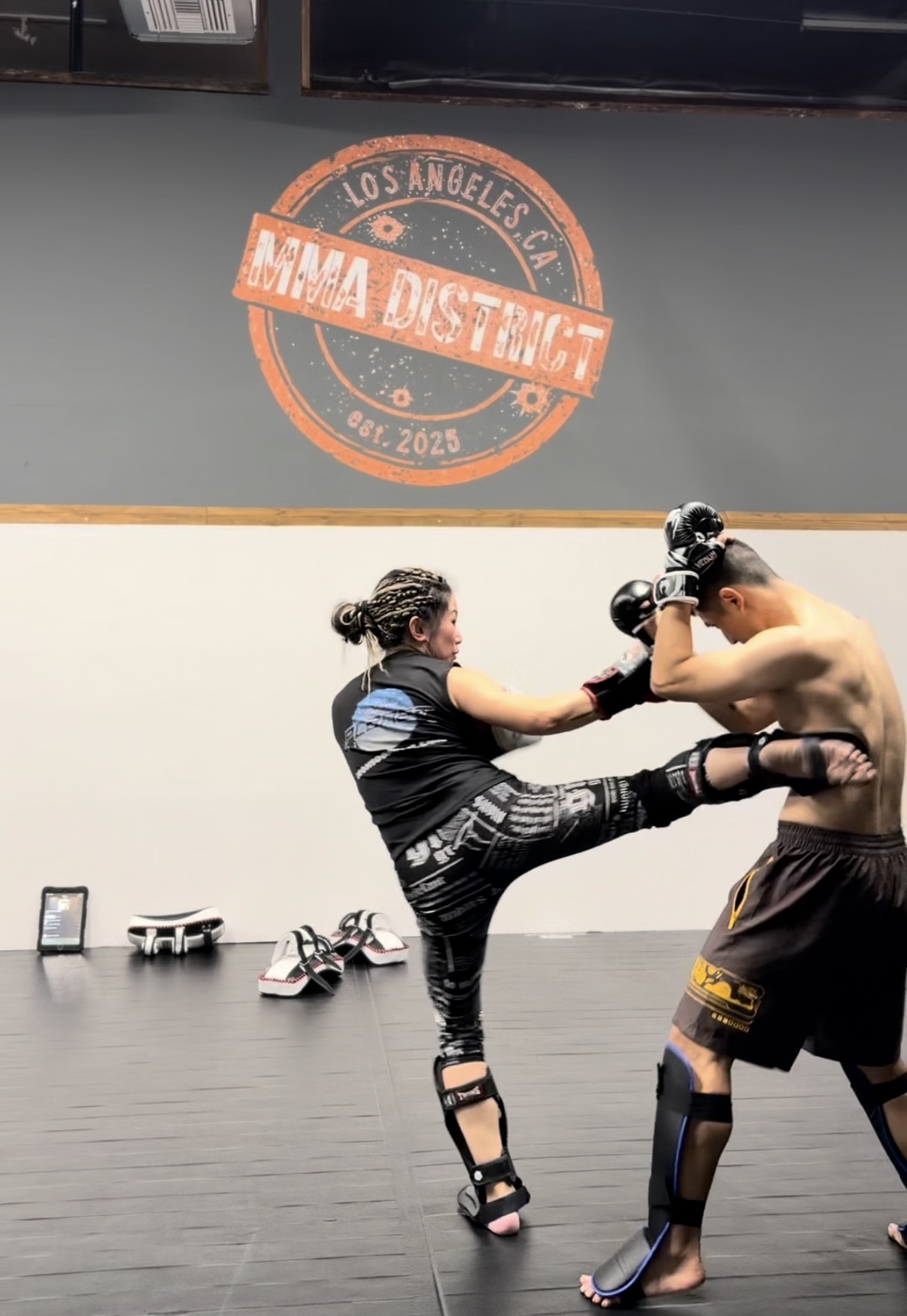 Boxing and grappling training at MMA District — Coach Dawn North brings 25+ years of experience